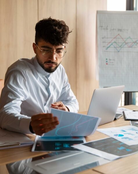 office-worker-using-finance-graphs (1) office-worker-using-finance-graphs (1)